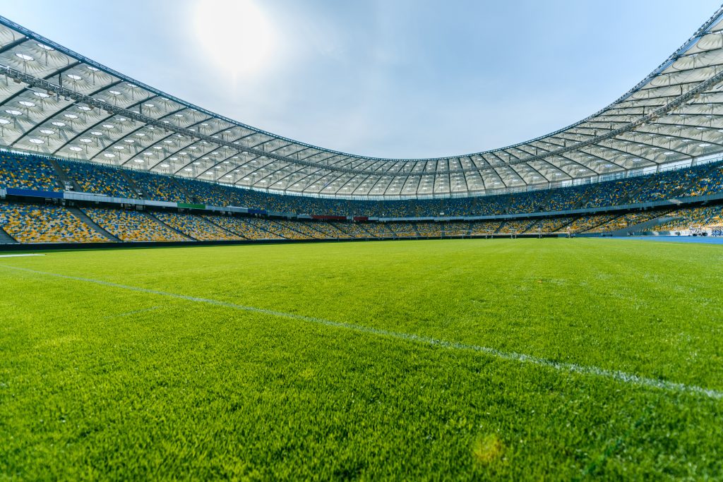 Panoramic view of soccer field stadium and stadium seats Fotboll